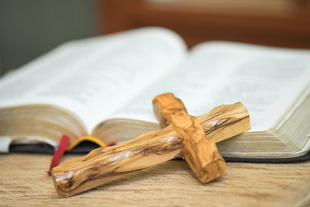 Wooden crafted cross and the holy bible of religion symbol